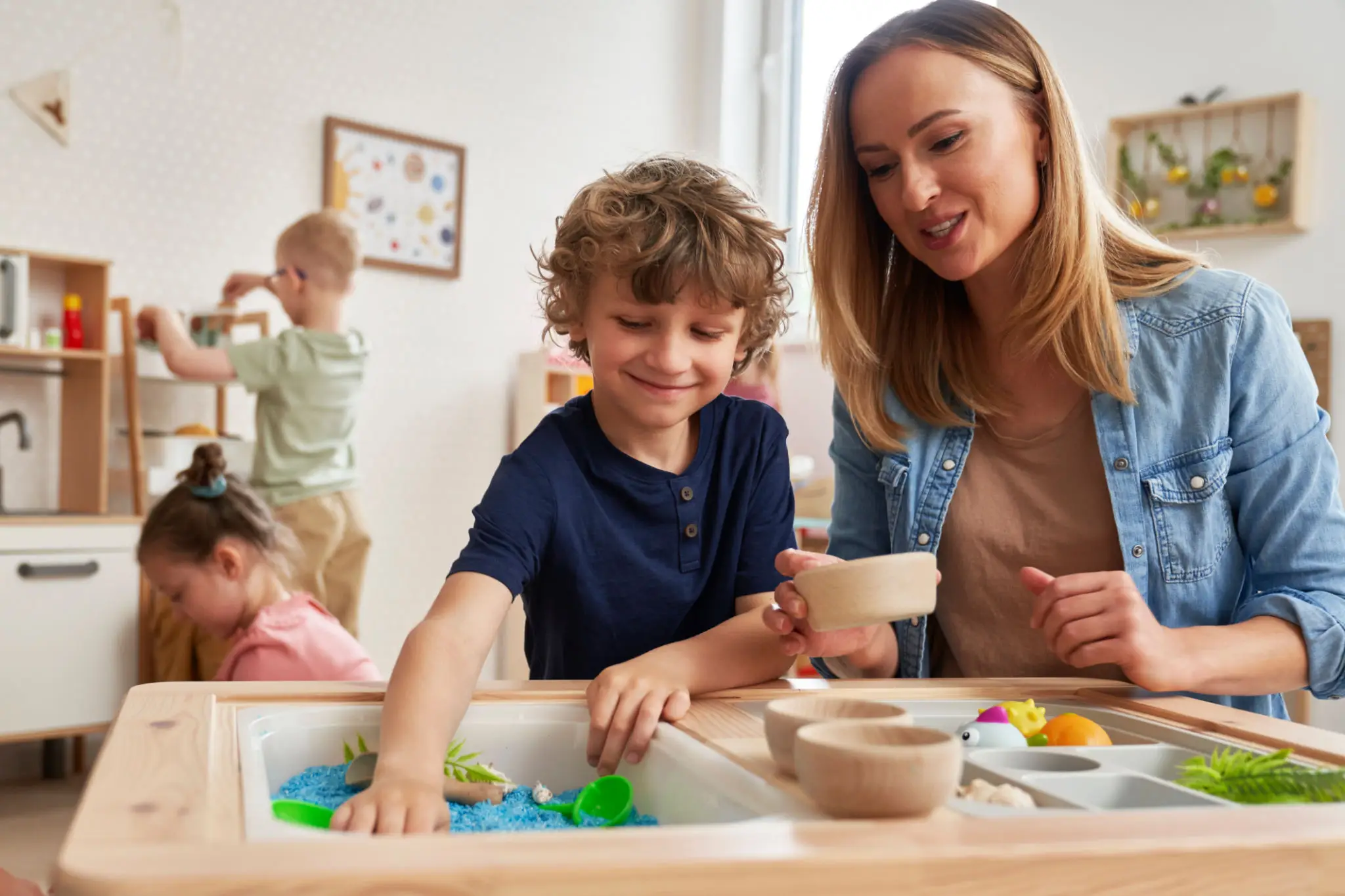 Woman and child at sensory play table
